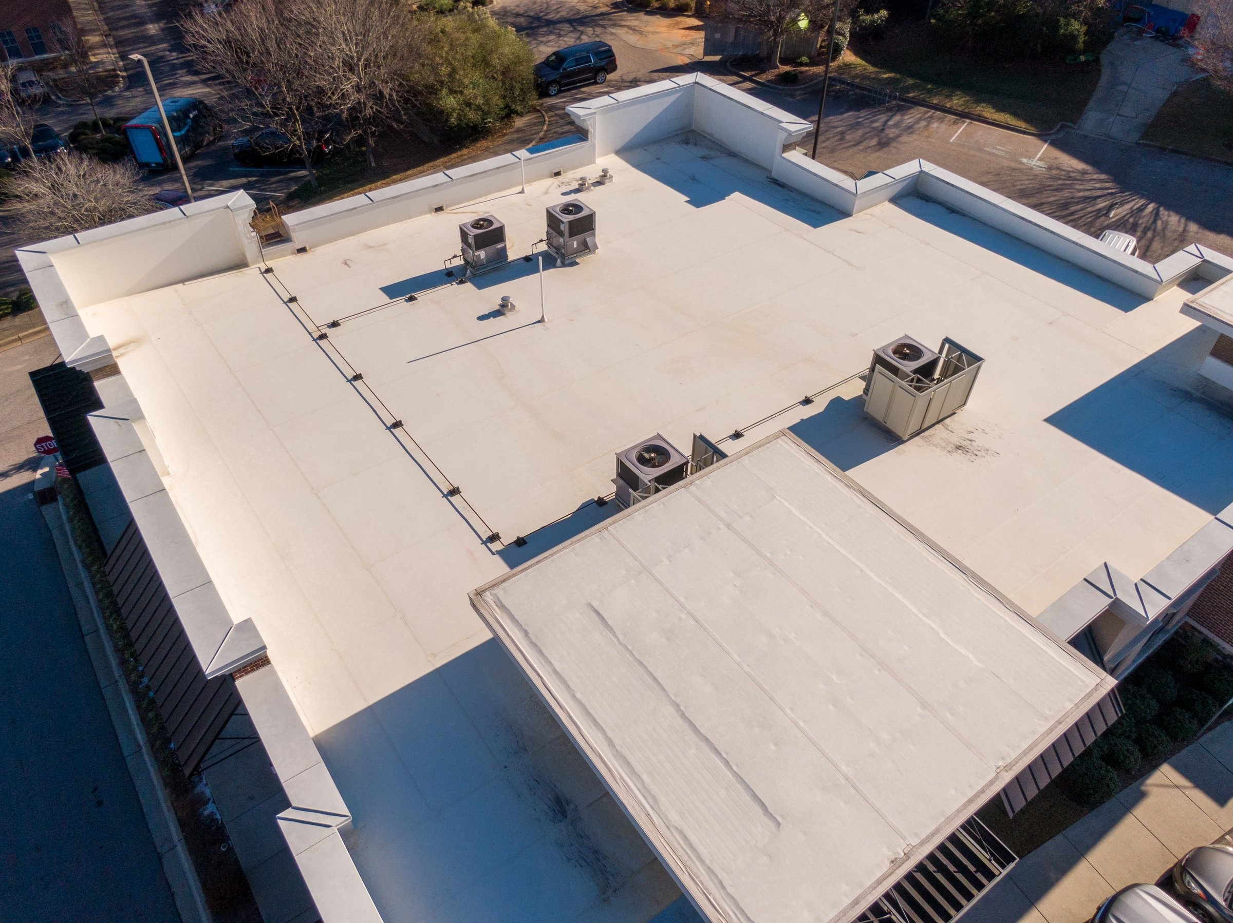 Professional Butynol roofing installation on commercial building