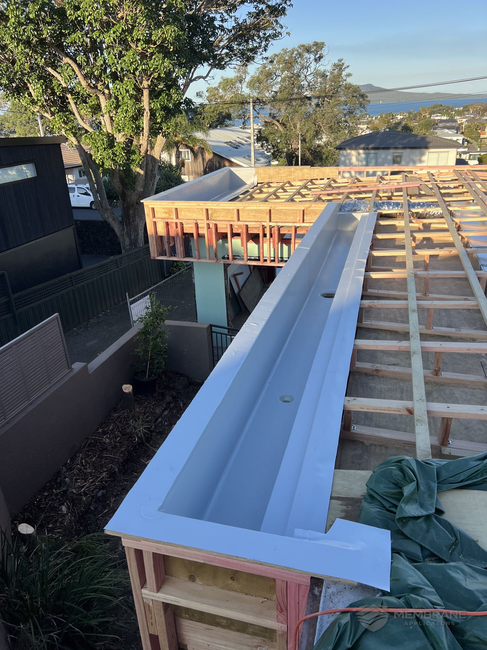 TPO membrane welded into a parapet gutter on an Auckland flat roof